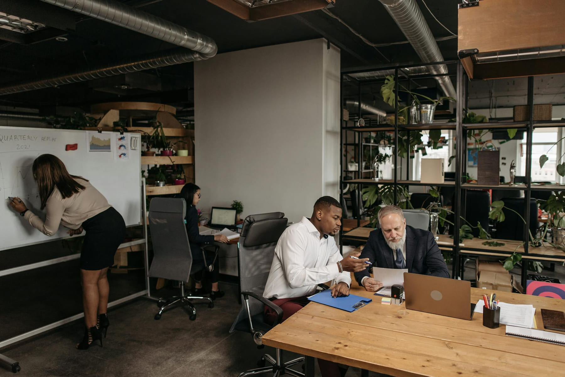 Diverse team collaborating in a modern office environment, planning strategy. on Small Biz Blueprint