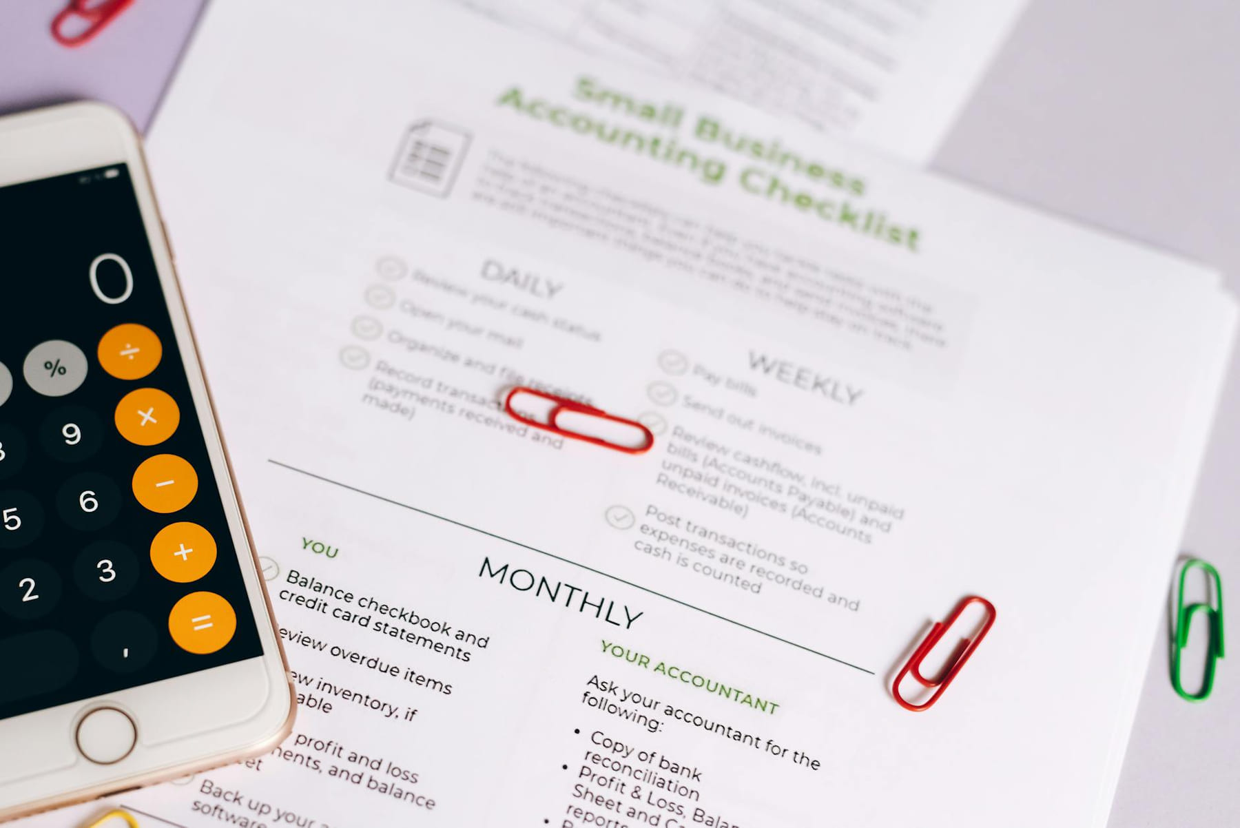 Image of a checklist and calculator for managing small business accounting tasks efficiently. on Small Biz Blueprint