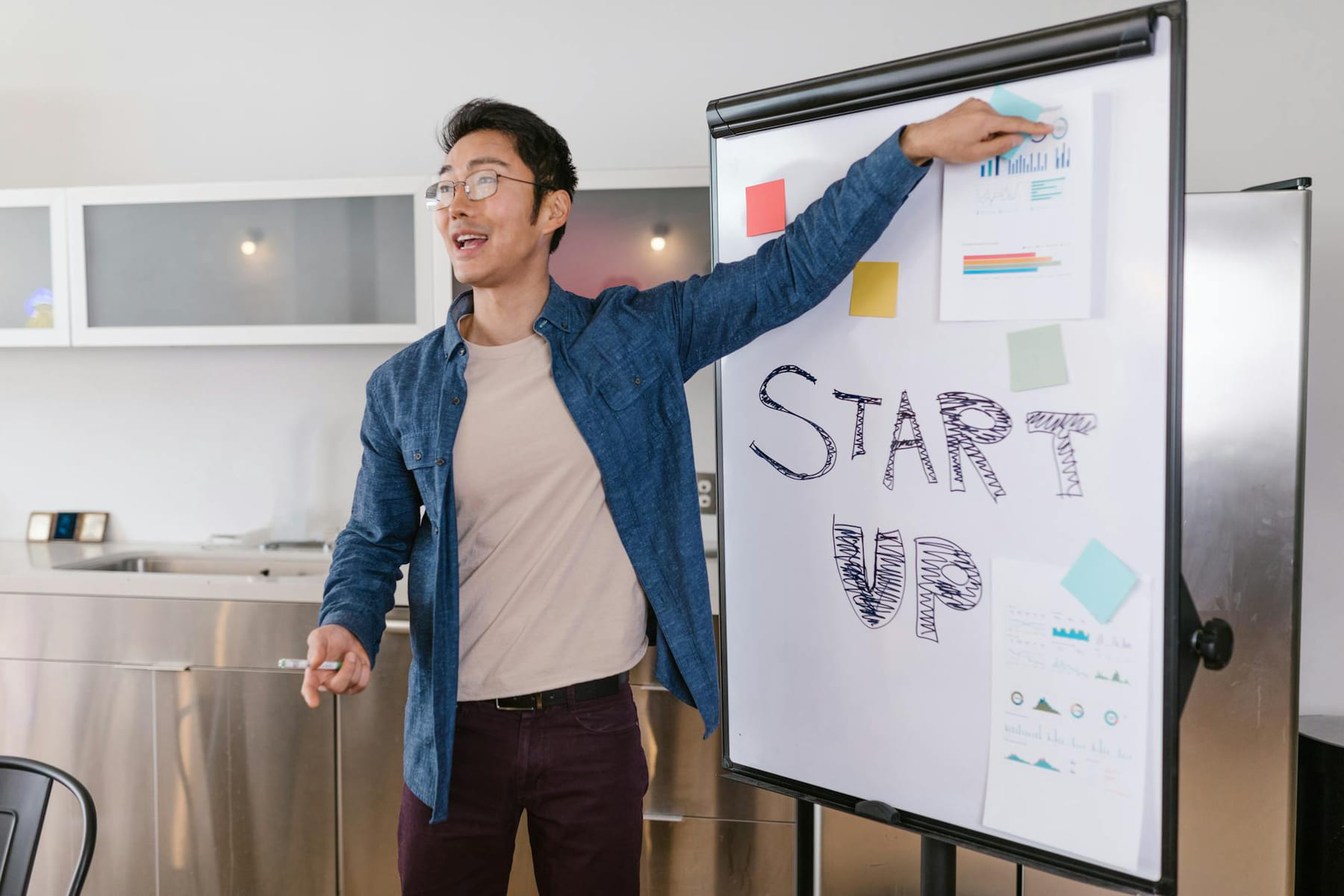 Entrepreneur presenting a startup plan at a meeting, engaging and dynamic business environment. on Small Biz Blueprint